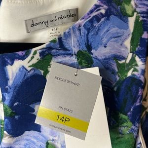 A blue and purple flower on white formal dress